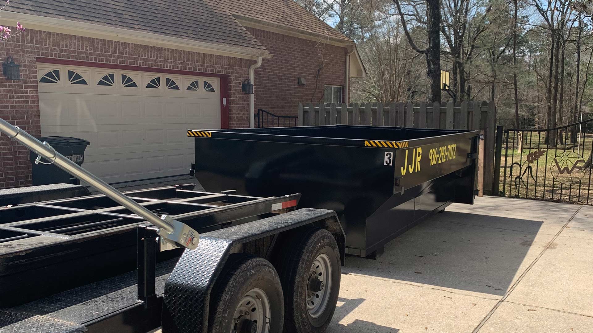 large dumpster at residential property exteriors montgomery tx